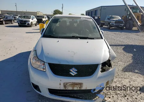 2012 Suzuki Sx4 Le z USA, uszkodzony, nr VIN JS2YC5A37C6303297
